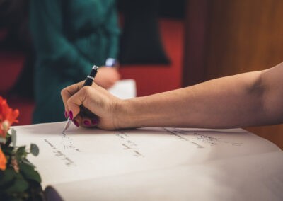 a person writing on a piece of paper